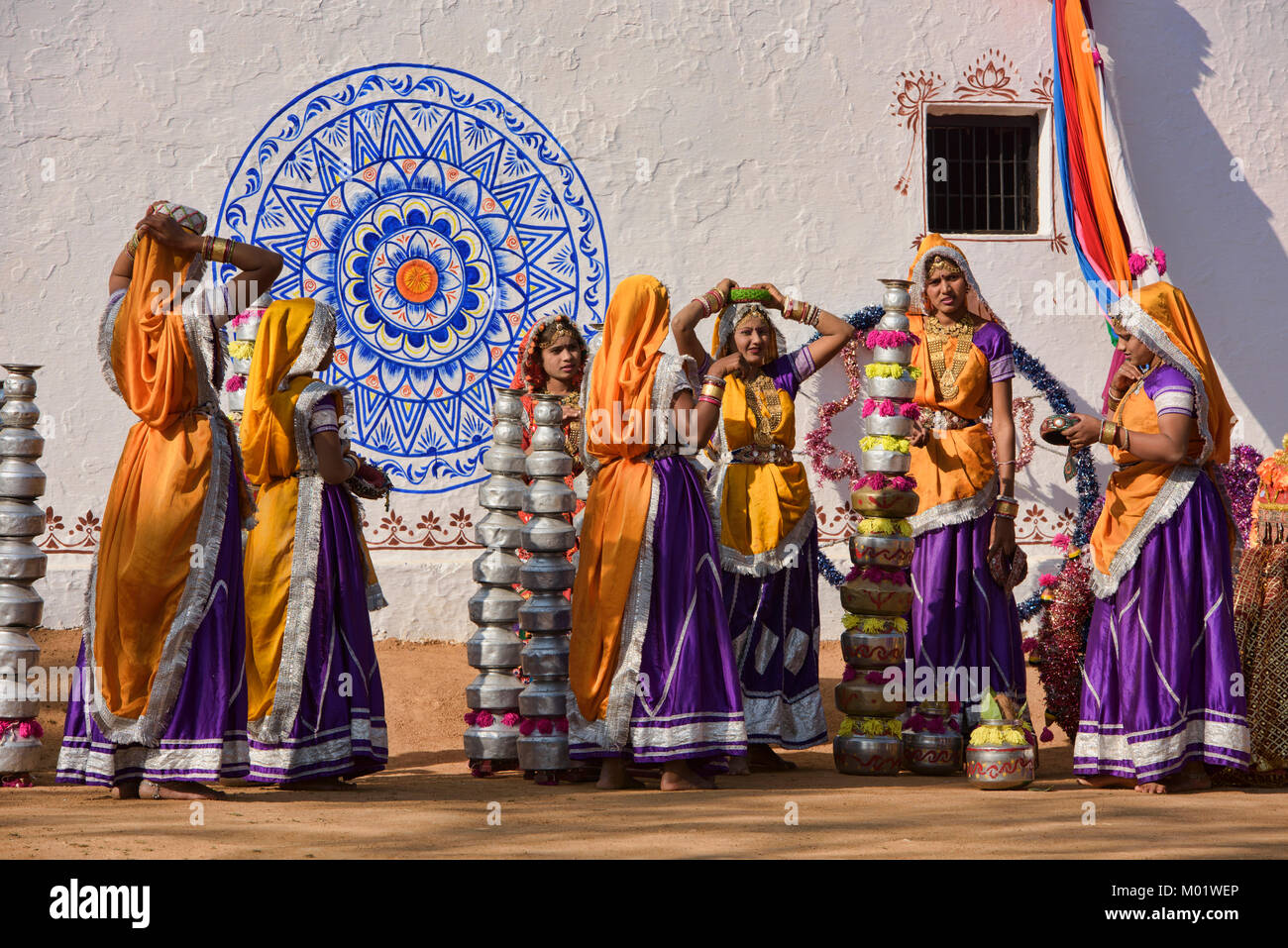 Women prepare to perform the Bhavai pot dance from Rajasthan and