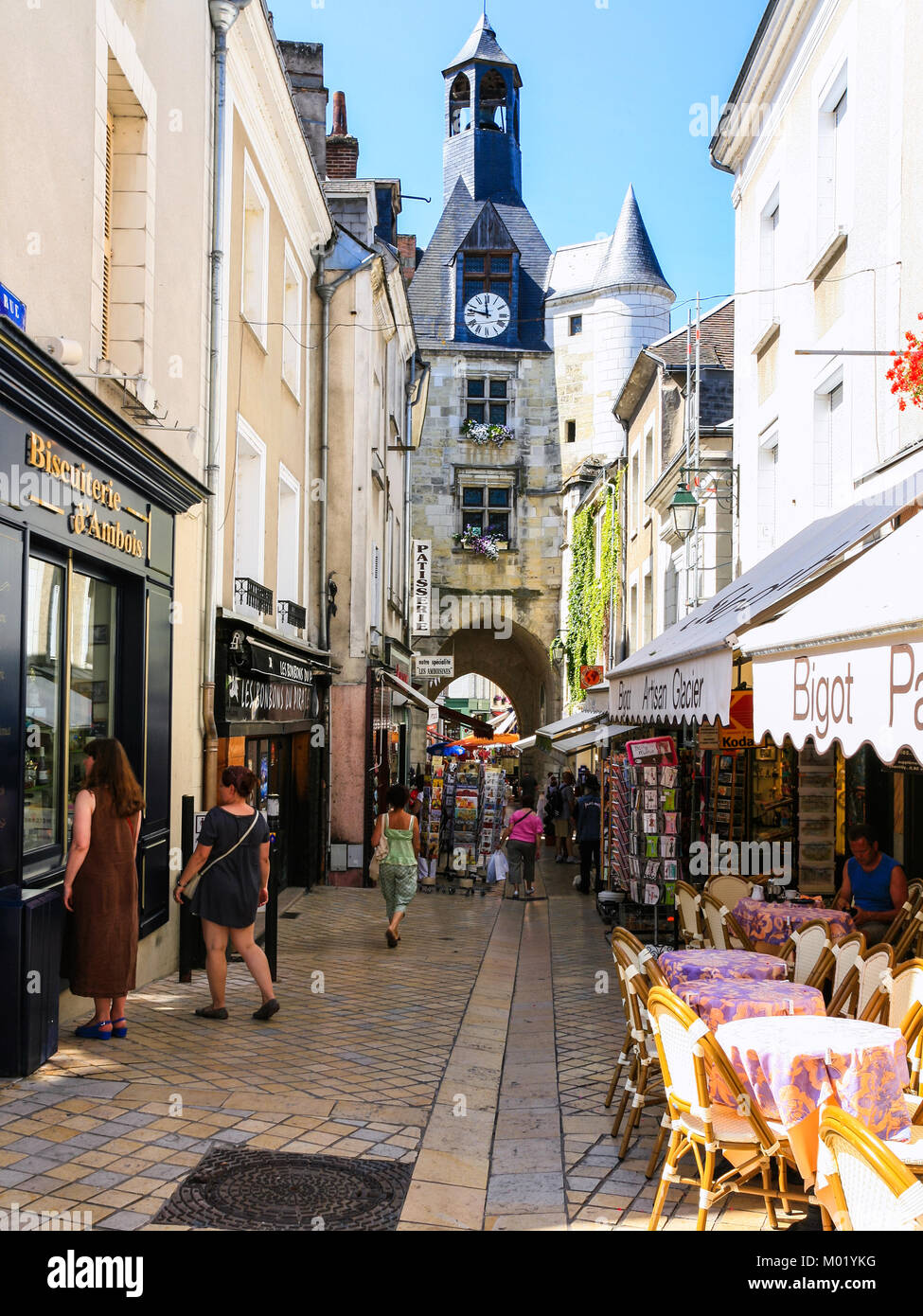 AMBOISE, FRANCE JULY 8, 2010 tourists near shops and clock tower on