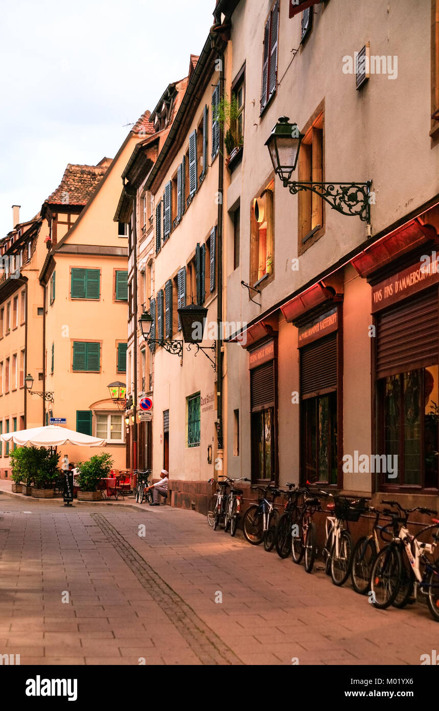 STRASBOURG, FRANCE - JULY 11, 2010: cook near restaurant on street Rue des Tailleurs de Pierre at sunset in Strasbourg. Strasbourg is capital of Grand Stock Photo