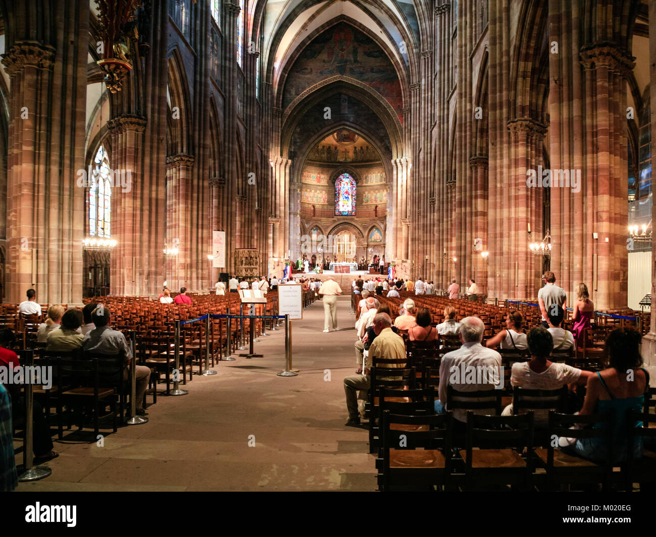 STRASBOURG, FRANCE - JULY 10, 2010: people during church service in Strasbourg Cathedral . Roman Catholic cathedral was built in 1015-1439 years in Ro Stock Photo
