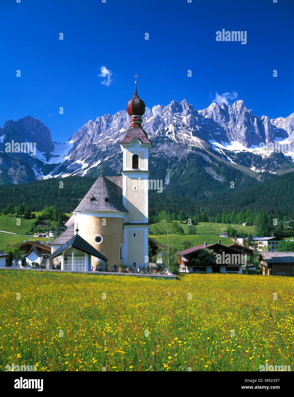 Going church and village and the Kaiser Wilhelm mountain, Tyrol, Austria range, Tirol, Austria Stock Photo