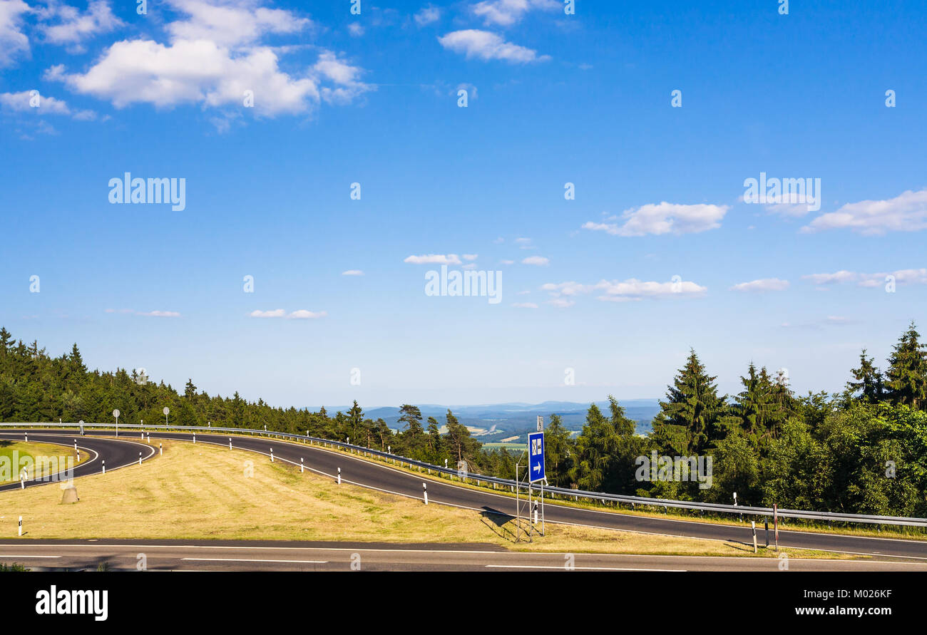 travel to Germany - view of road on Rimberg mount to Rest and Service Station on Autobahn A5 motorway near Breitenbach am Herzberg town in Hesse State Stock Photo