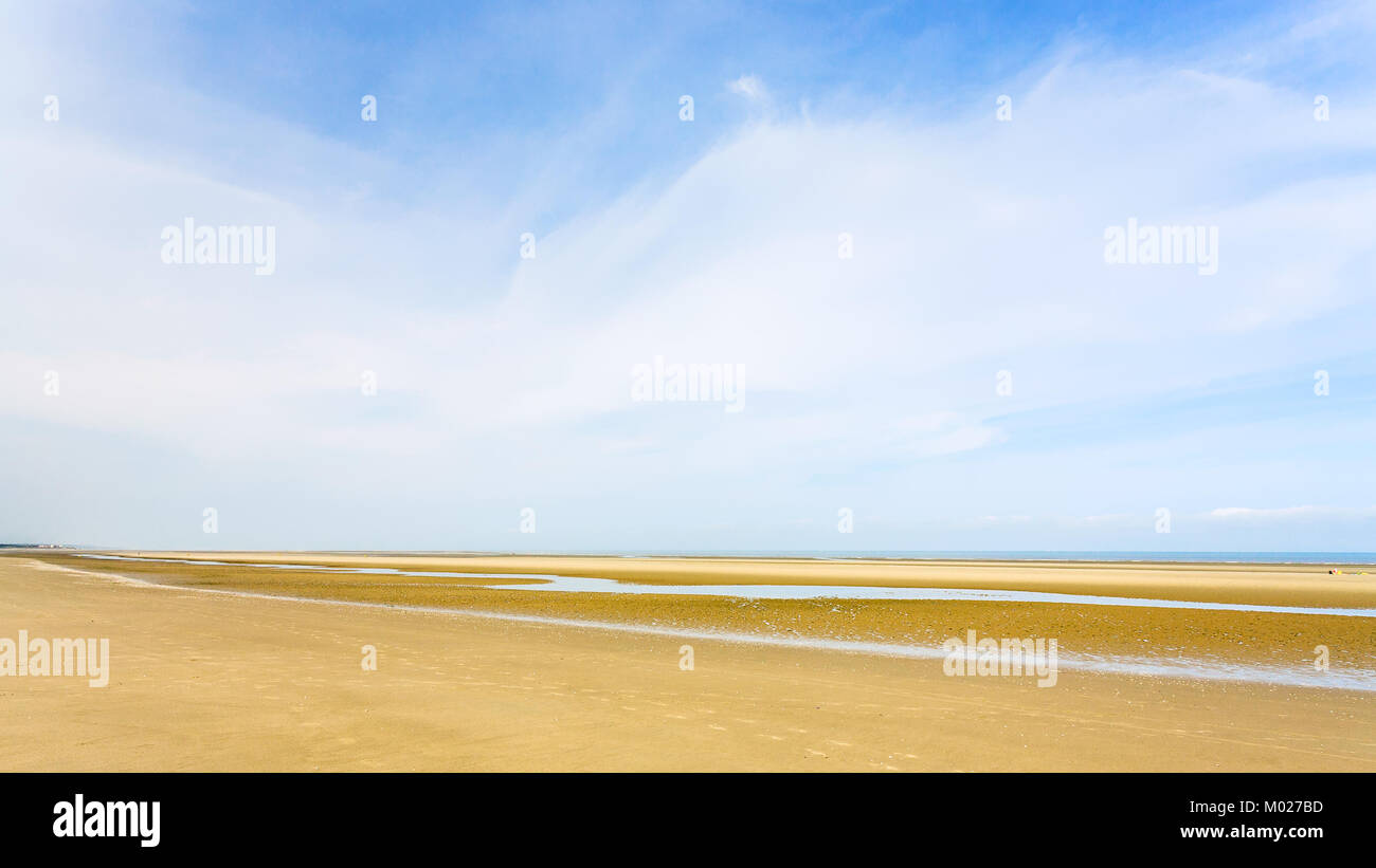 travel to France - panoramic view of blue sky over yellow sand beach of Le Touquet (Le Touquet-Paris-Plage) on coast of English Channel Stock Photo