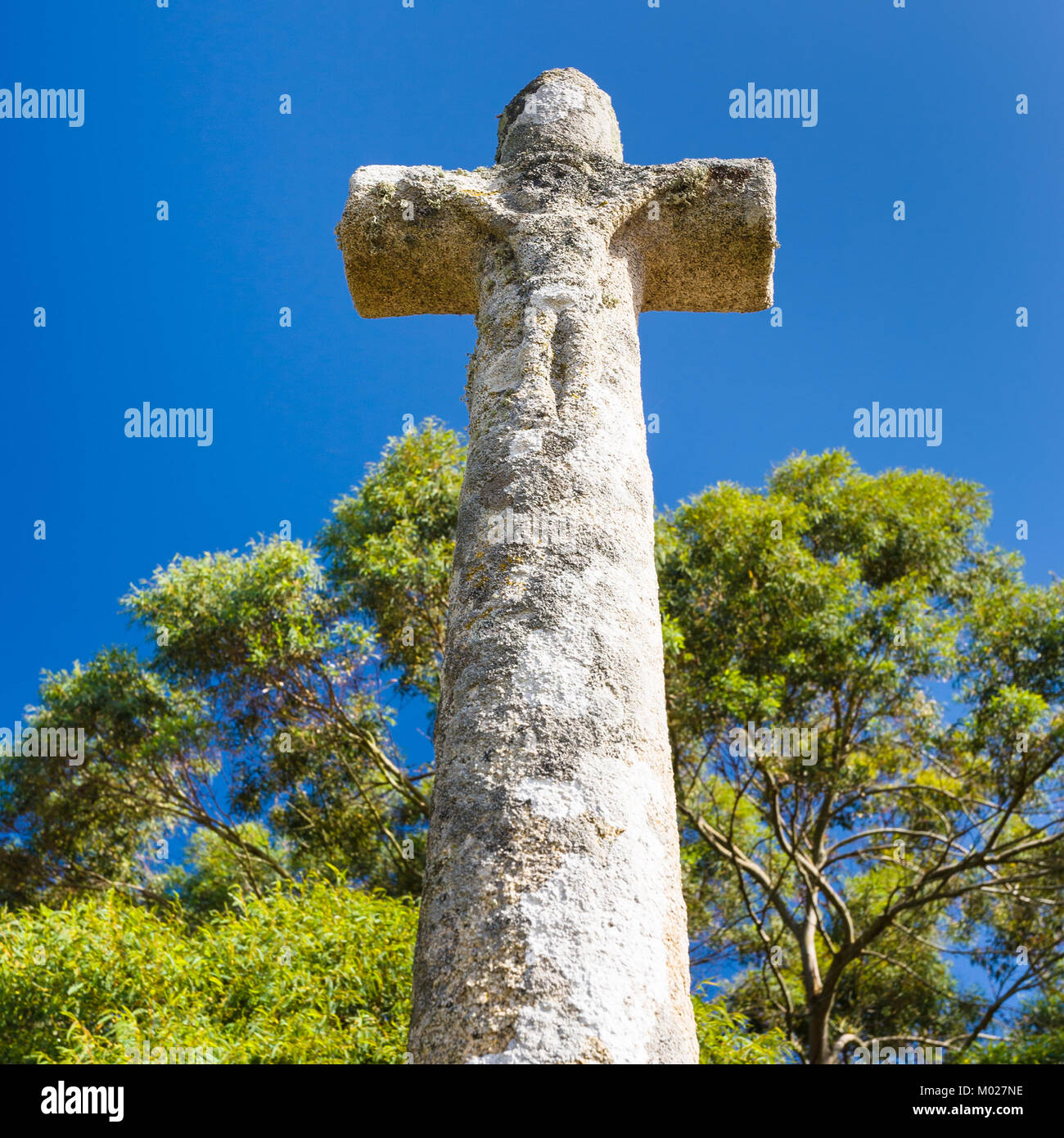 travel to France - old stone celtic cross near Saint-Guirec beach of Perros-Guirec commune on Pink Granite Coast of Cotes-d'Armor department in the no Stock Photo