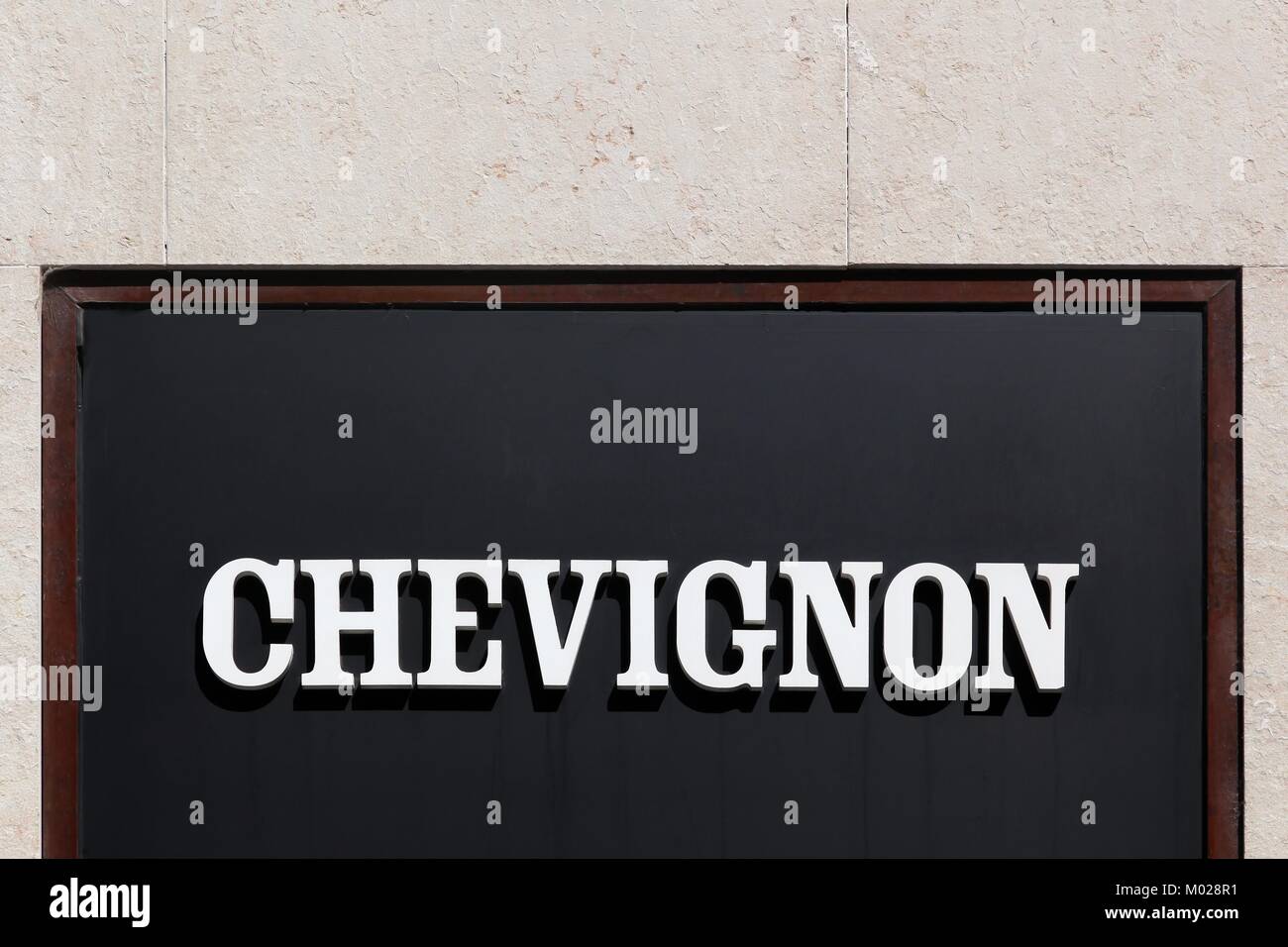 Lyon, France - May 26, 2017: Chevignon logo on a wall. Chevignon is a ...