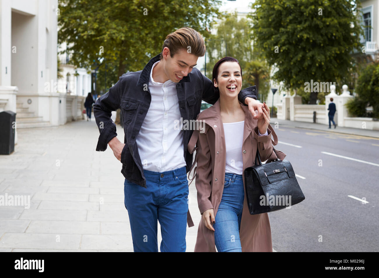 Chic young couple walking in the street in Notting Hill Gate Stock Photo