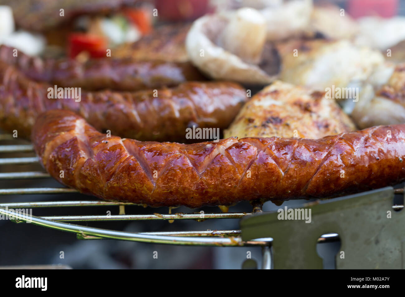 barbecue with delicious grilled meat and vegetables on grill Stock ...