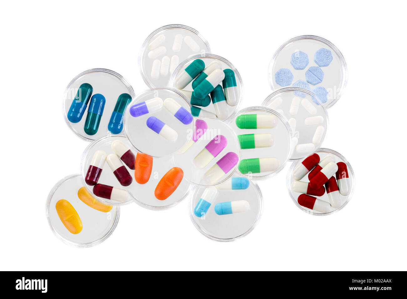 Healthcare and mmedical concept: addiction,stack of Medicine Tablets in glass petri dish on white background Stock Photo