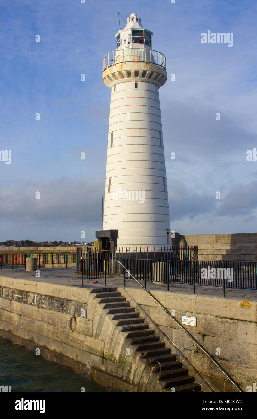The famous tapered cylindical tower lighthouse and lamp on the stone ...