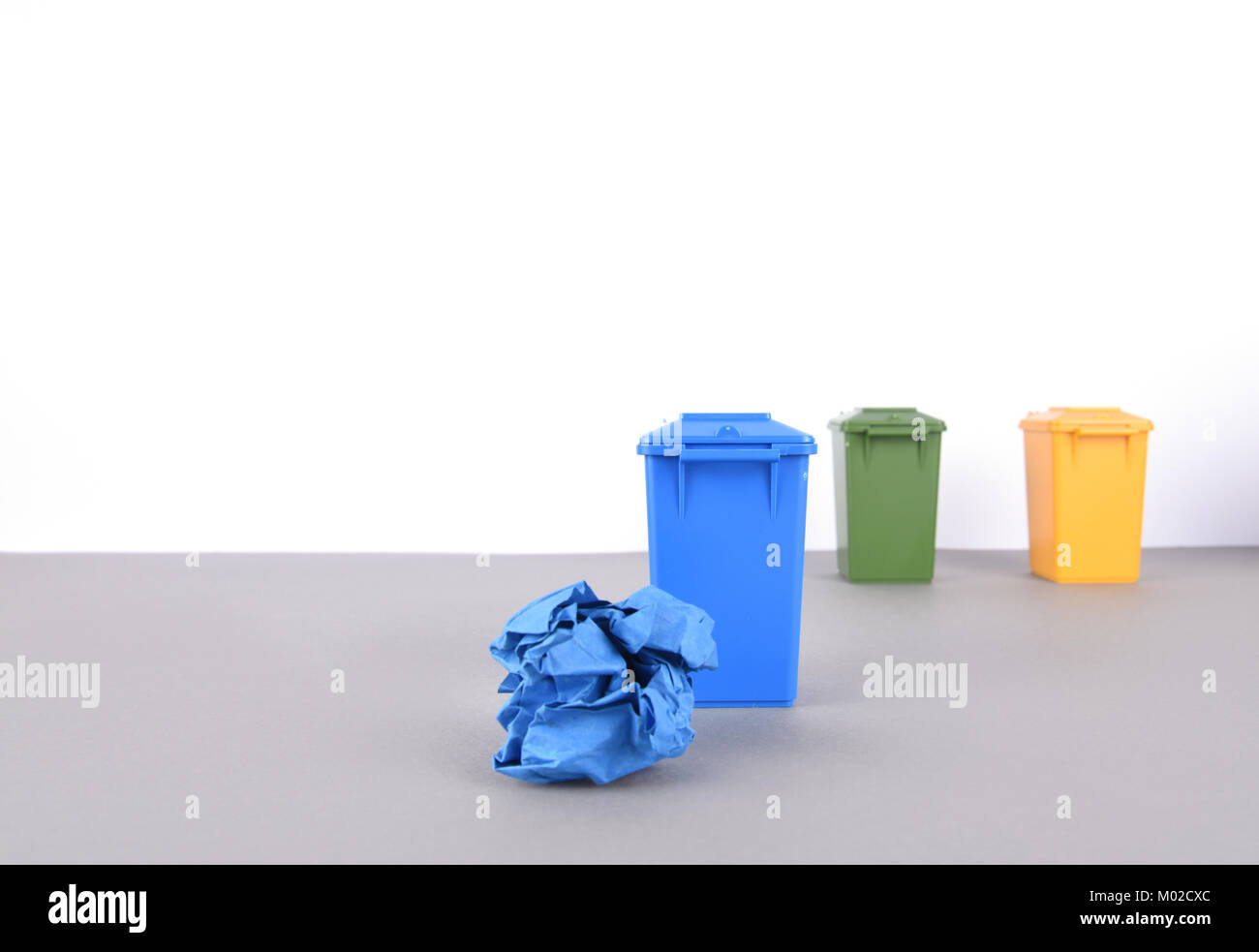 Colorful recycle bins on white background Stock Photo - Alamy