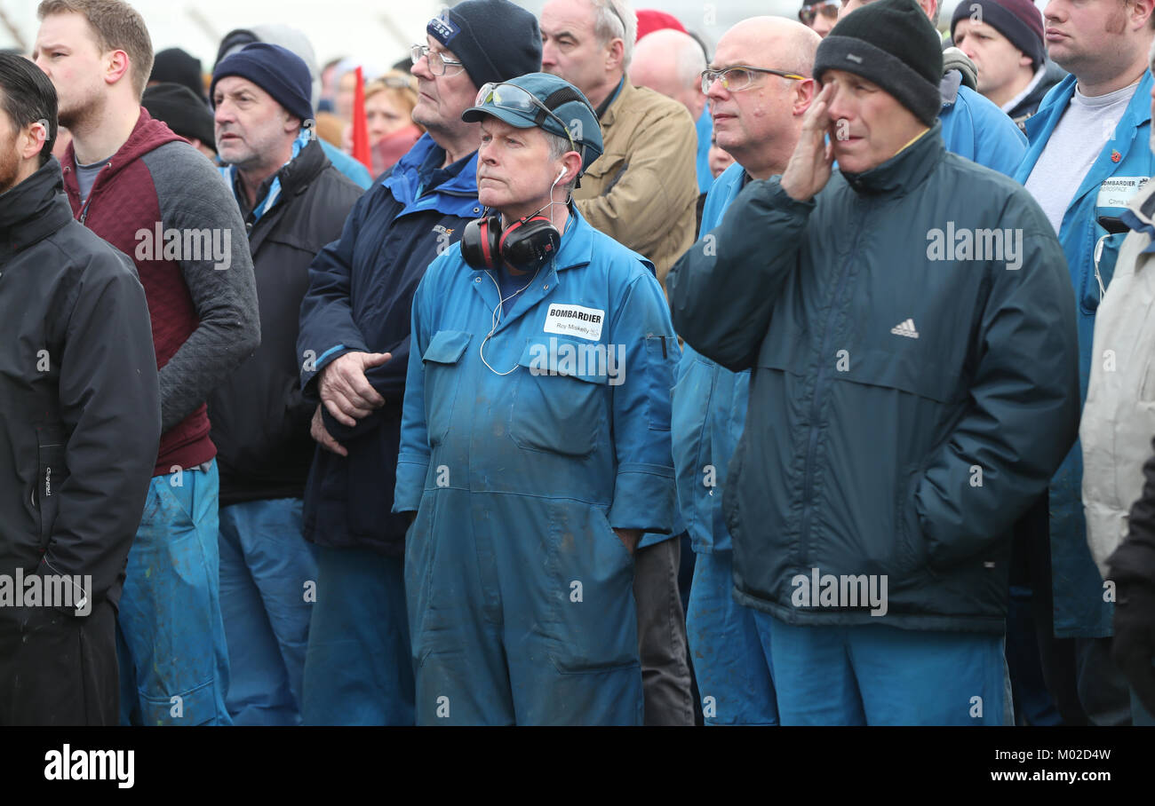 Bombardier workers in Belfast gather for a rally at the factory gates, as a union leader warns that thousands of workers will 'flex their muscles' if a trade ruling goes against aircraft manufacturer. Stock Photo