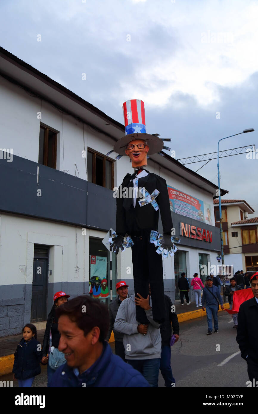 A protester carries an effigy of Peruvian President Kuczynski during a protest against pardon granted to Alberto Fujimori, Cusco, Peru Stock Photo
