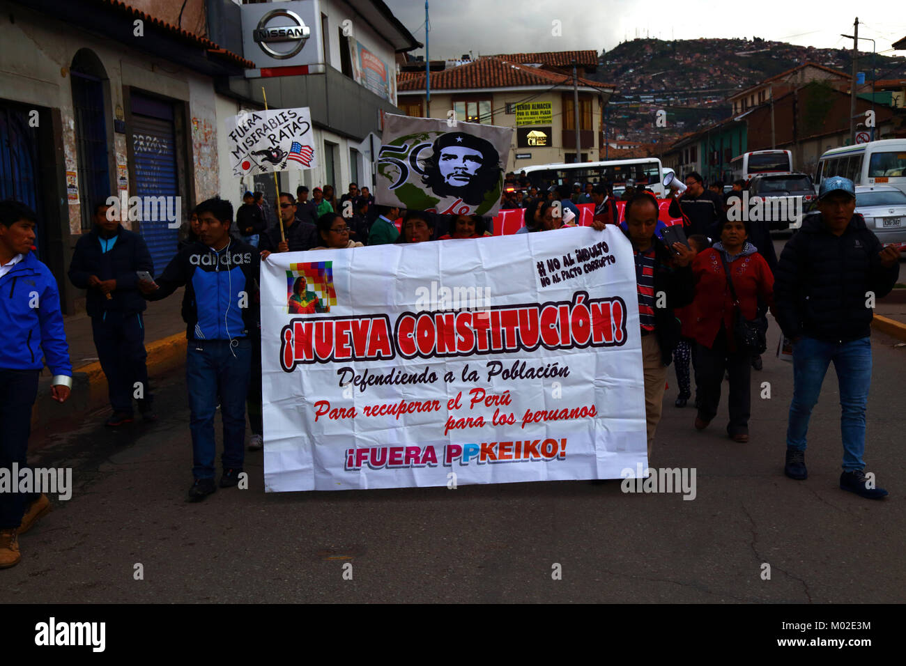 Protesters carry a banner demanding a new constitution during a protest march against corruption, Cusco, Peru Stock Photo