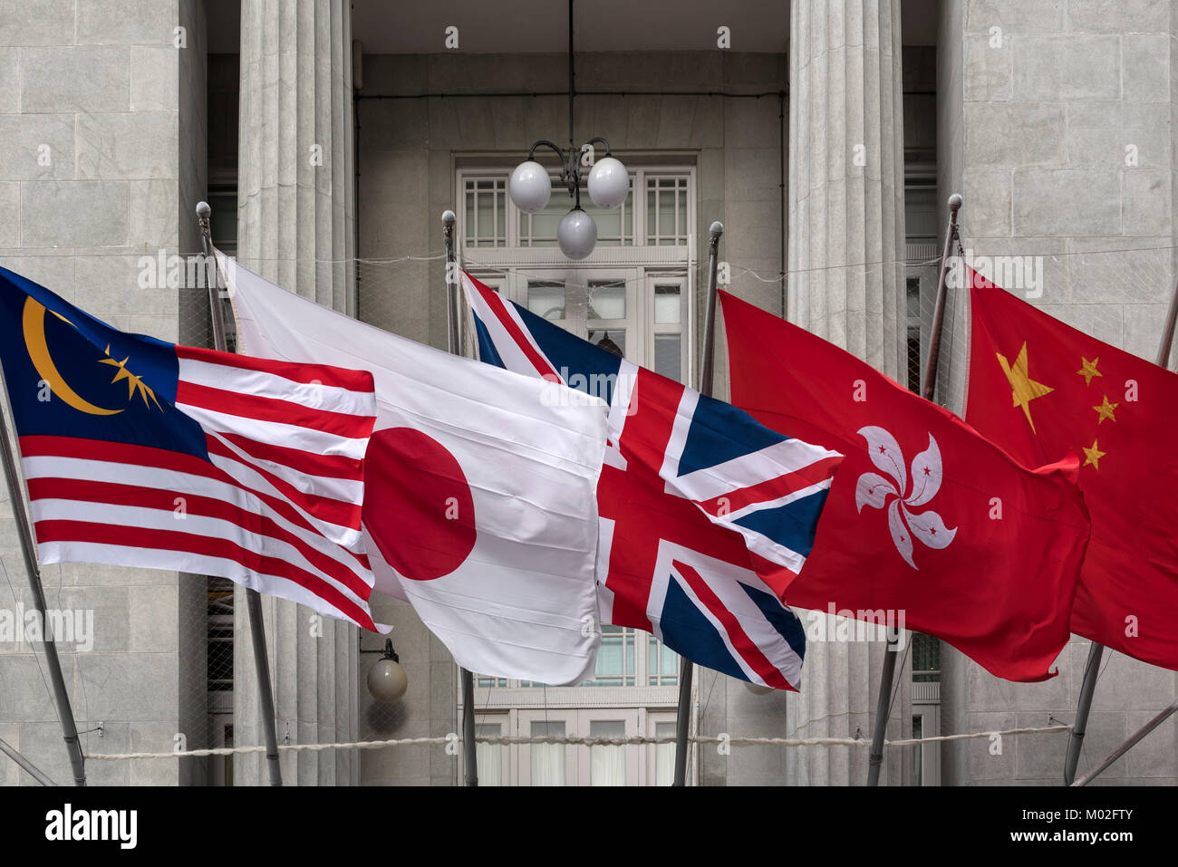 Flags of Malaysia, Japan, United Kingdom (upside down), Hong Kong and China Stock Photo