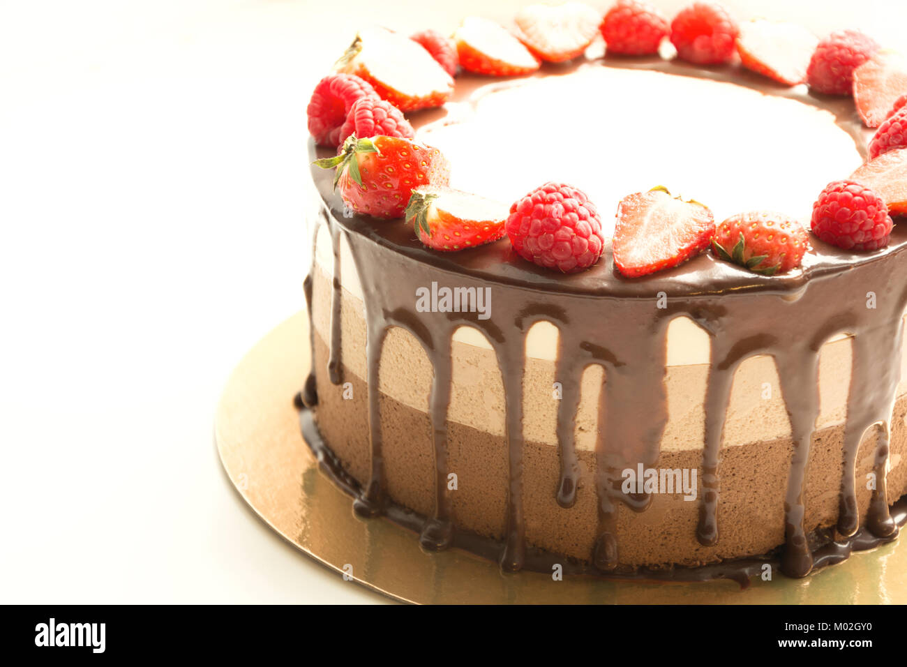 Cake three chocolate with fresh strawberry isolated on white background ...
