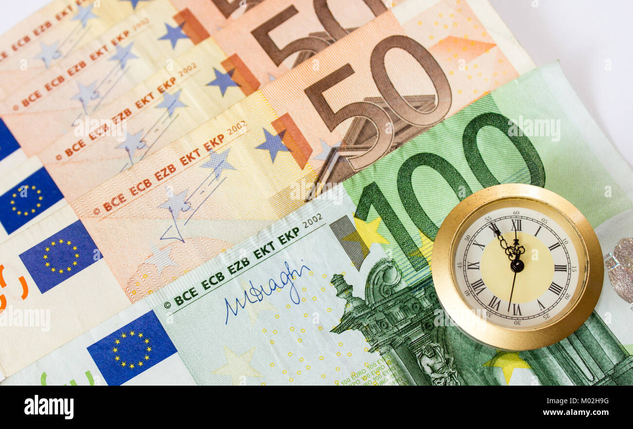 European banknotes like background and watch that have five to twelve time. Highest time for action. Stock Photo