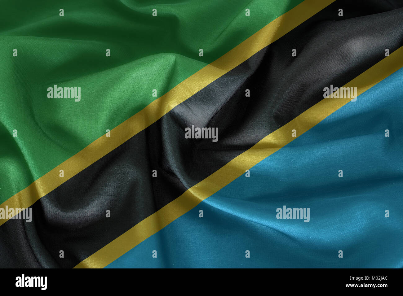 Waving Fabric Flag of Tanzania Stock Photo - Alamy