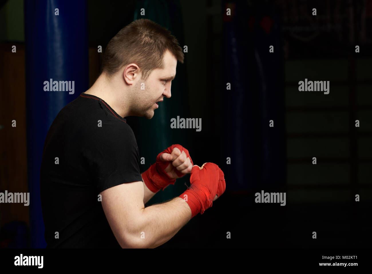 Ready to boxing fight man. One caucasian boxer man profile view Stock Photo