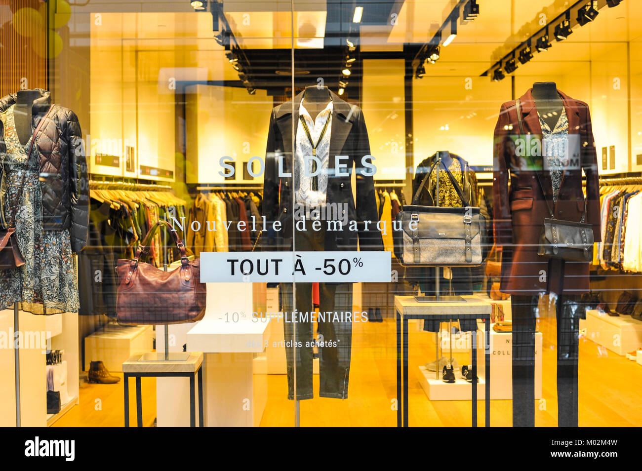 Sale (soldes in french) sign in a fashion shop window. Auchan Supermarket,  Luxembourg Stock Photo - Alamy
