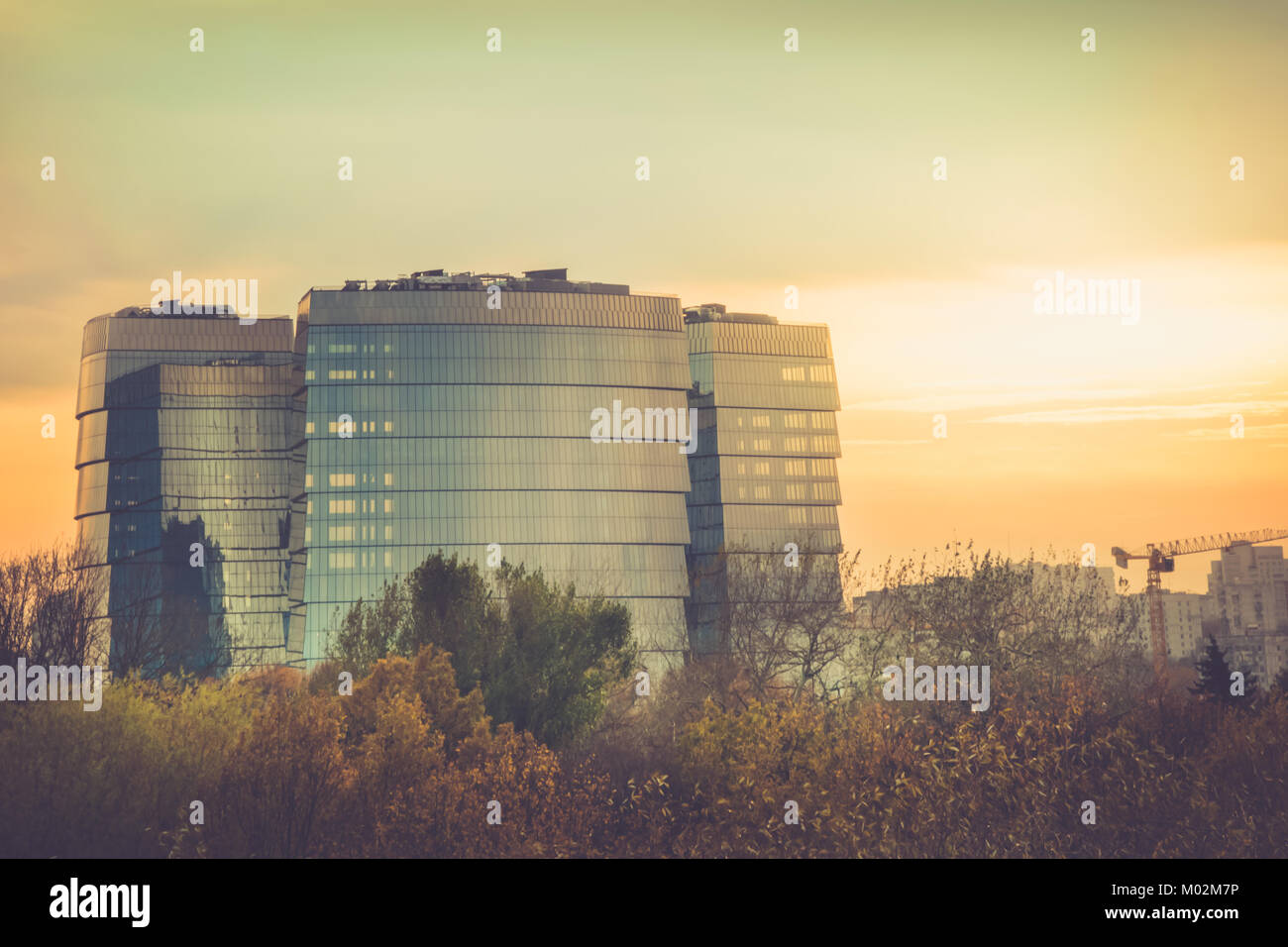 Amazing view of an office high-rise building of glass on a sunset ...