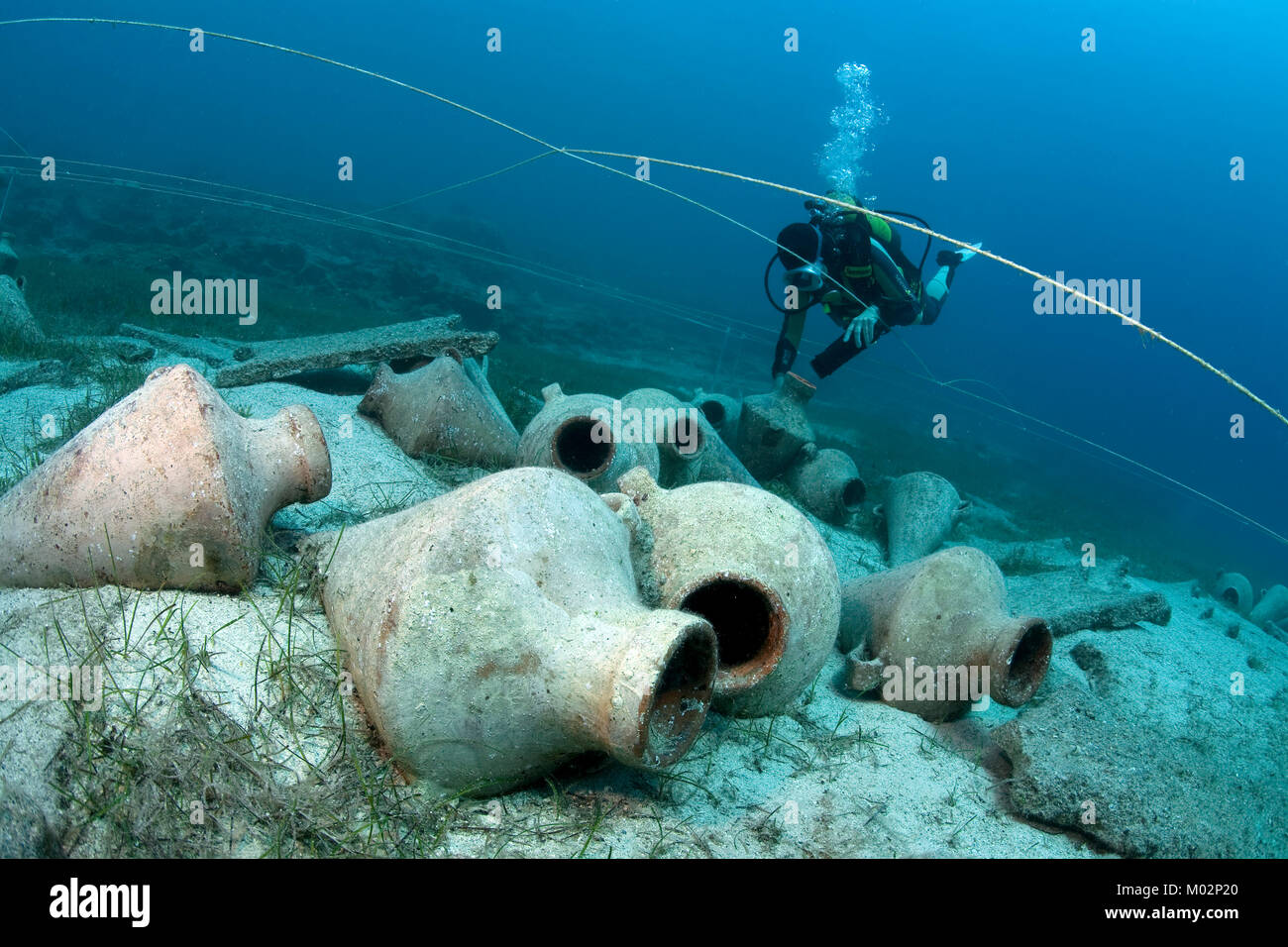 Scuba diver at amphora field (replicas) placed at source of Uluburun wreck, oldest ship wreck of the world, Kas, Lykia, Turkey, Mediteranean sea Stock Photo