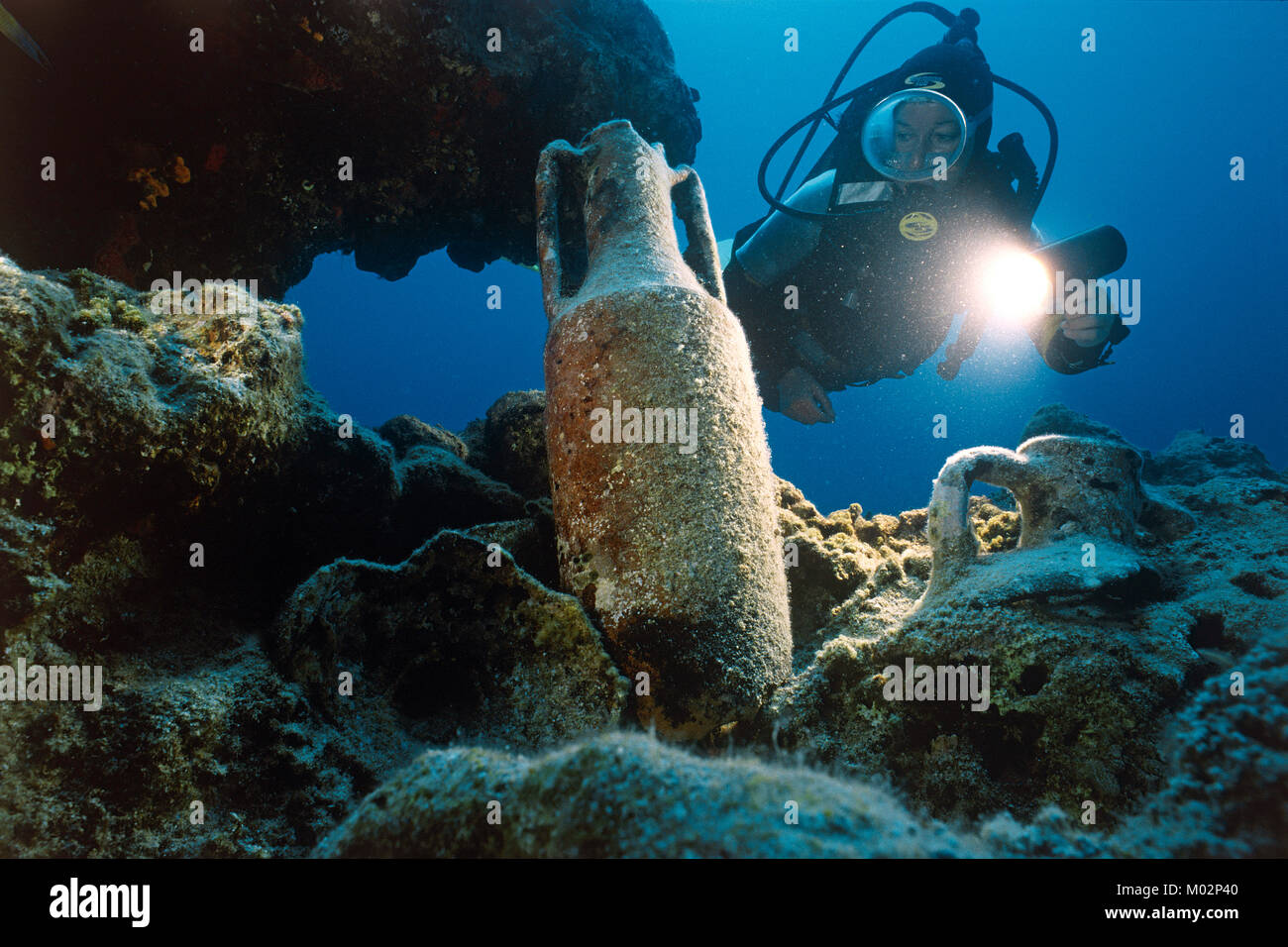 Scuba diver discover old ancient amphoras on seabed, Lykia, Mediterranean sea, Turkey Stock Photo
