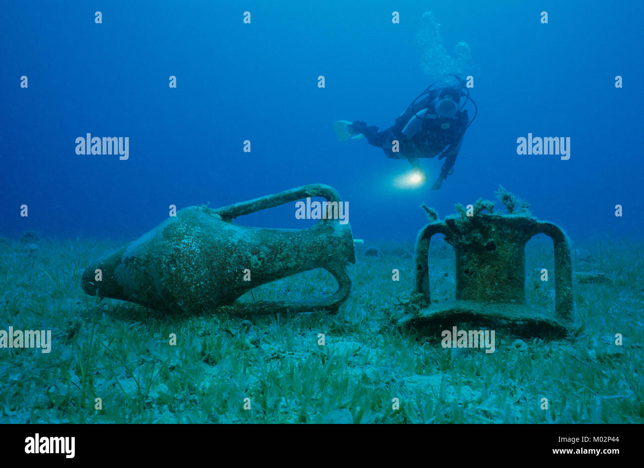 Scuba diver discover old ancient amphoras on seabed, Lykia, Mediterranean sea, Turkey Stock Photo