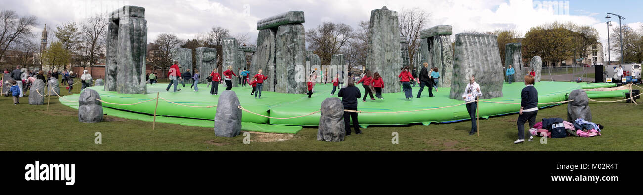 kids enjoy plastic version of Stonehenge by Turner Prize winning artist Jeremy Deller on Glasgow green before it went to London Olympic Games 2012 Stock Photo