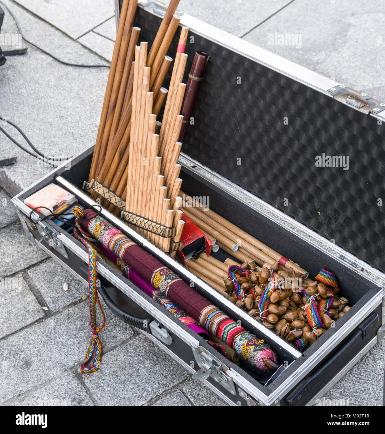 Andean musical instruments in case on street. Pan flutes, zampona, siku.  Folk music. Stock Photo