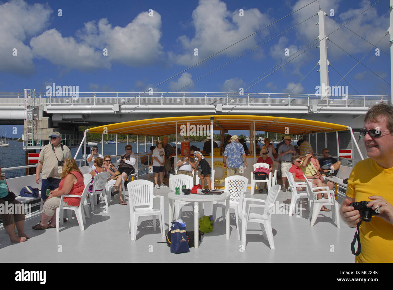 Passengers enjoying a relaxing time on a short local boat cruise Stock Photo