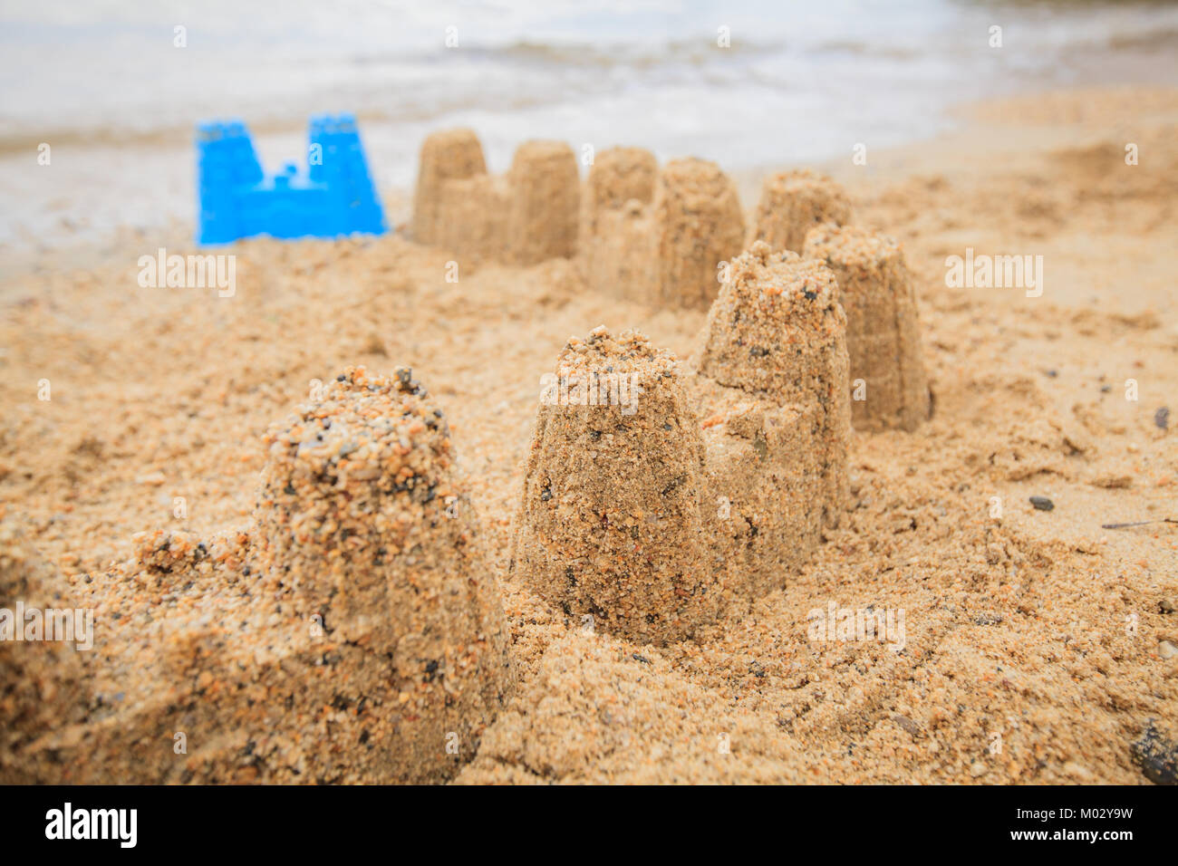 Sand castle on the beach , creative summer activity on vacation Stock ...