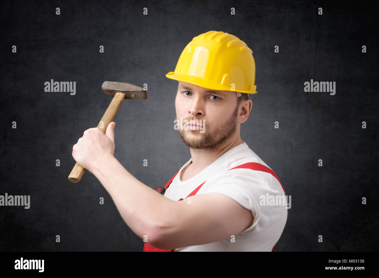 Construction worker with hammer Stock Photo Alamy