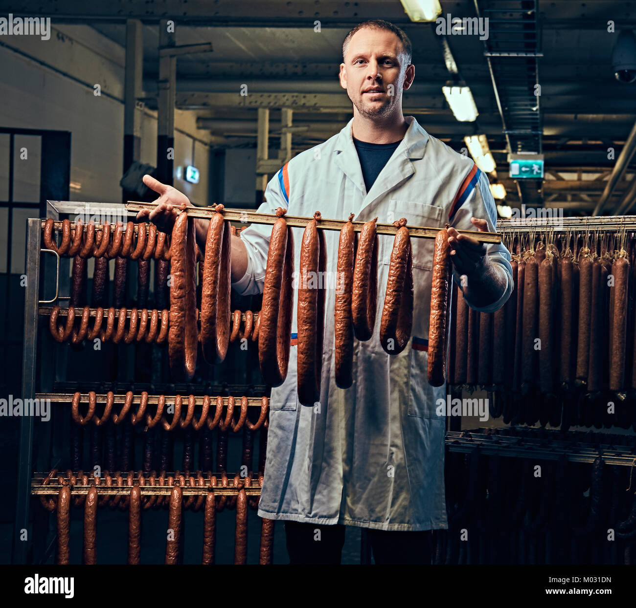 A man in sausage storage Stock Photo Alamy