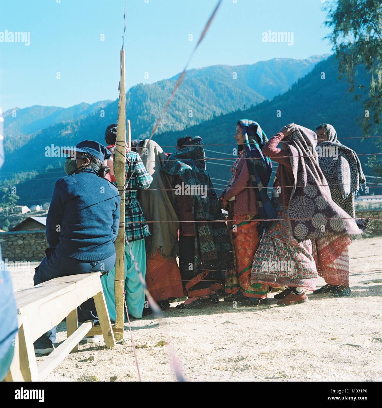 Women voters queue at an outdoor polling station in Jumla District, NW Nepal, during voting for Parliamentary and Provincial Elections in Nov 2017 Stock Photo