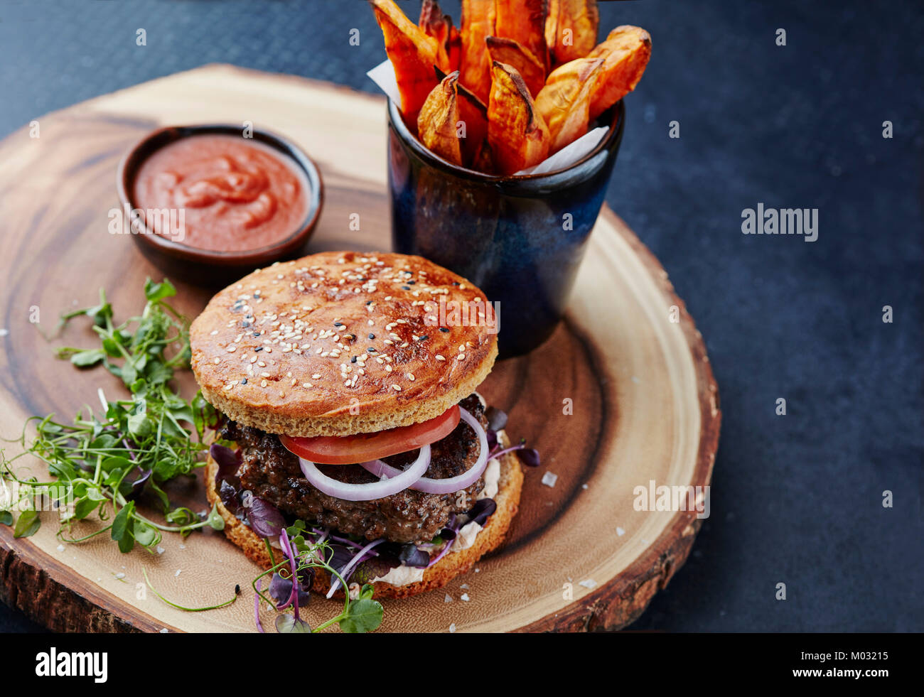 Healthy burger with sweet potato fries Stock Photo - Alamy
