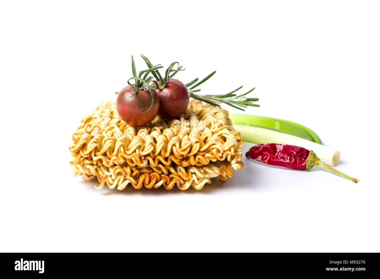 Uncooked pasta and tomato chili isolated on white background Stock Photo