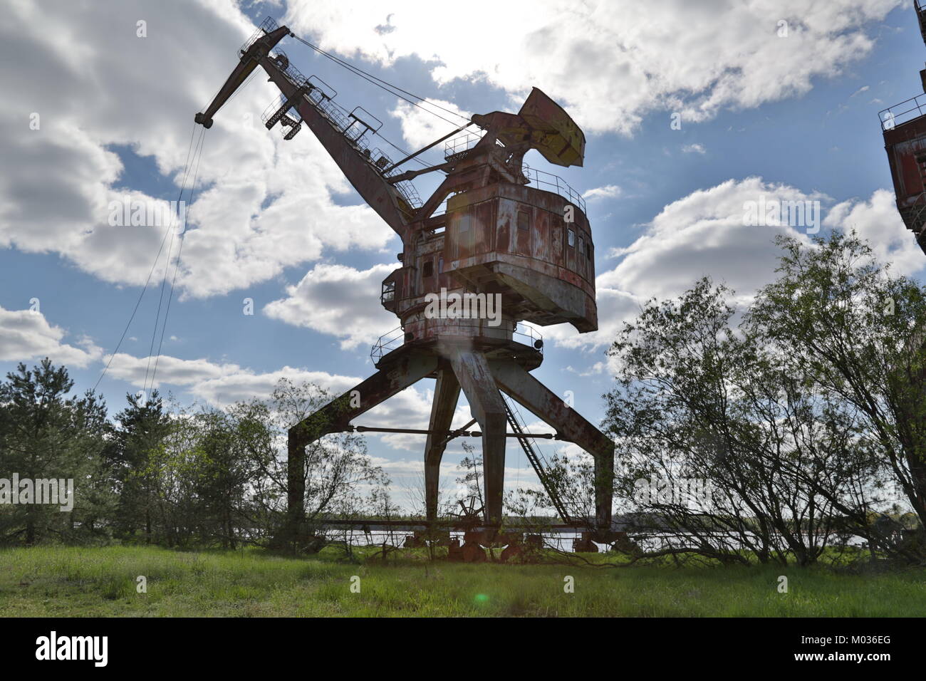 Abandoned cranes in the Chernobyl river port Stock Photo