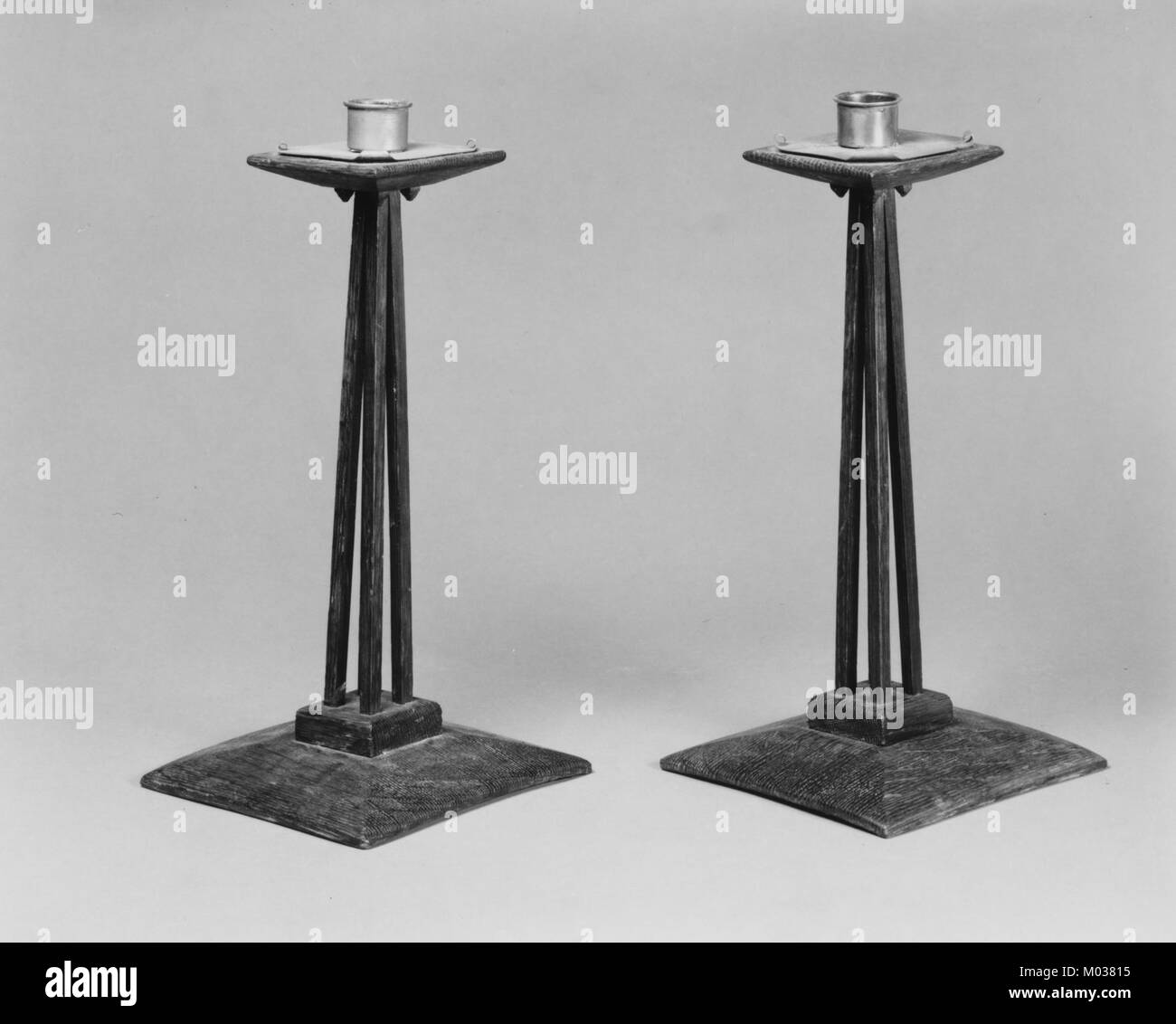 This candlestick, part of The Metropolitan Museum of Art's collection, is an example of fine craftsmanship in decorative arts. The design showcases elegant detail and is an important piece of decorative history. Stock Photo