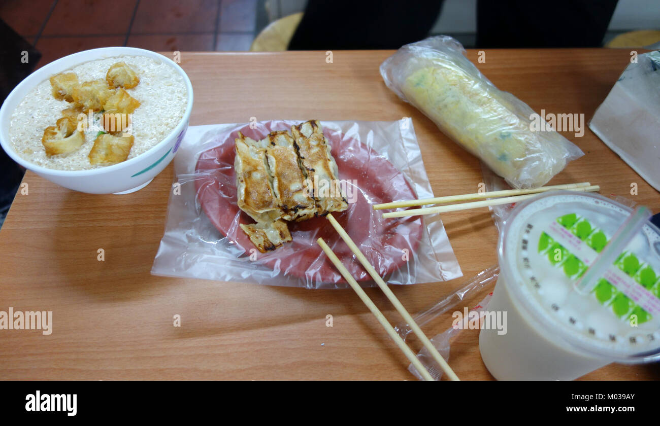The image captures a scene of breakfast at Tung-hai Hua-yuan Bie-shu, a location in Taichung, Taiwan, known for its food culture and local setting. Stock Photo