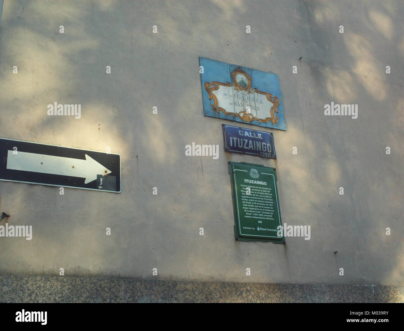 The Calle Ituzaingo sign marks a street in Latin America, often named after historical figures or significant events in regional history. It is an important element of local urban navigation and heritage. Stock Photo
