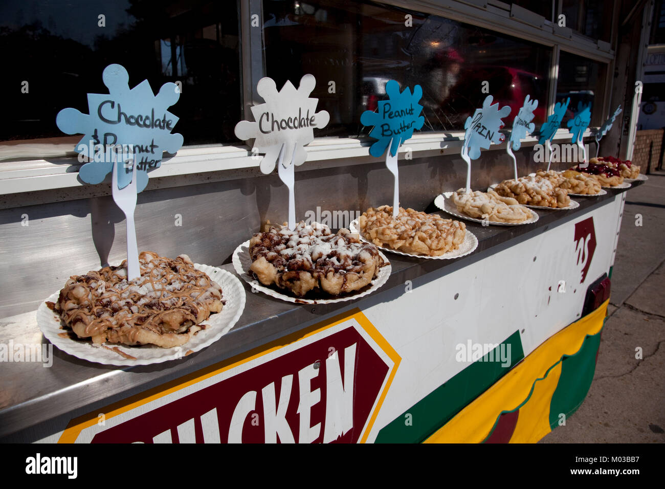 Funnel cakes are available in many flavors at the Mardi Gras celebration in Mobile, Alabama Stock Photo