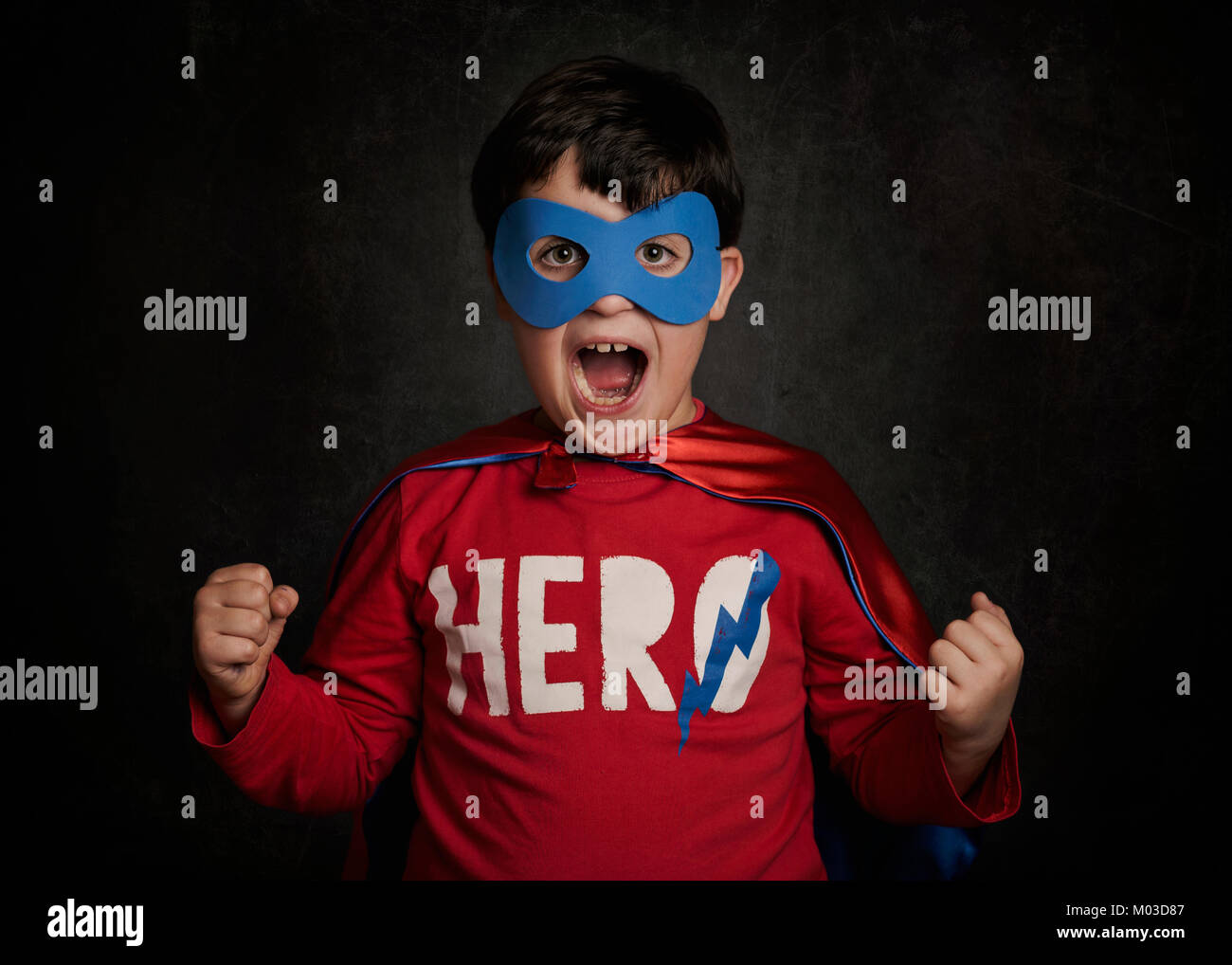 Happy little child playing superhero Stock Photo