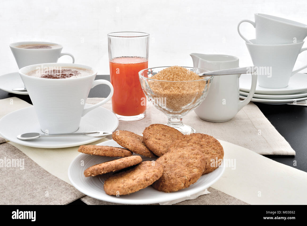 cappuccino biscuits orange juice cocoa Stock Photo Alamy