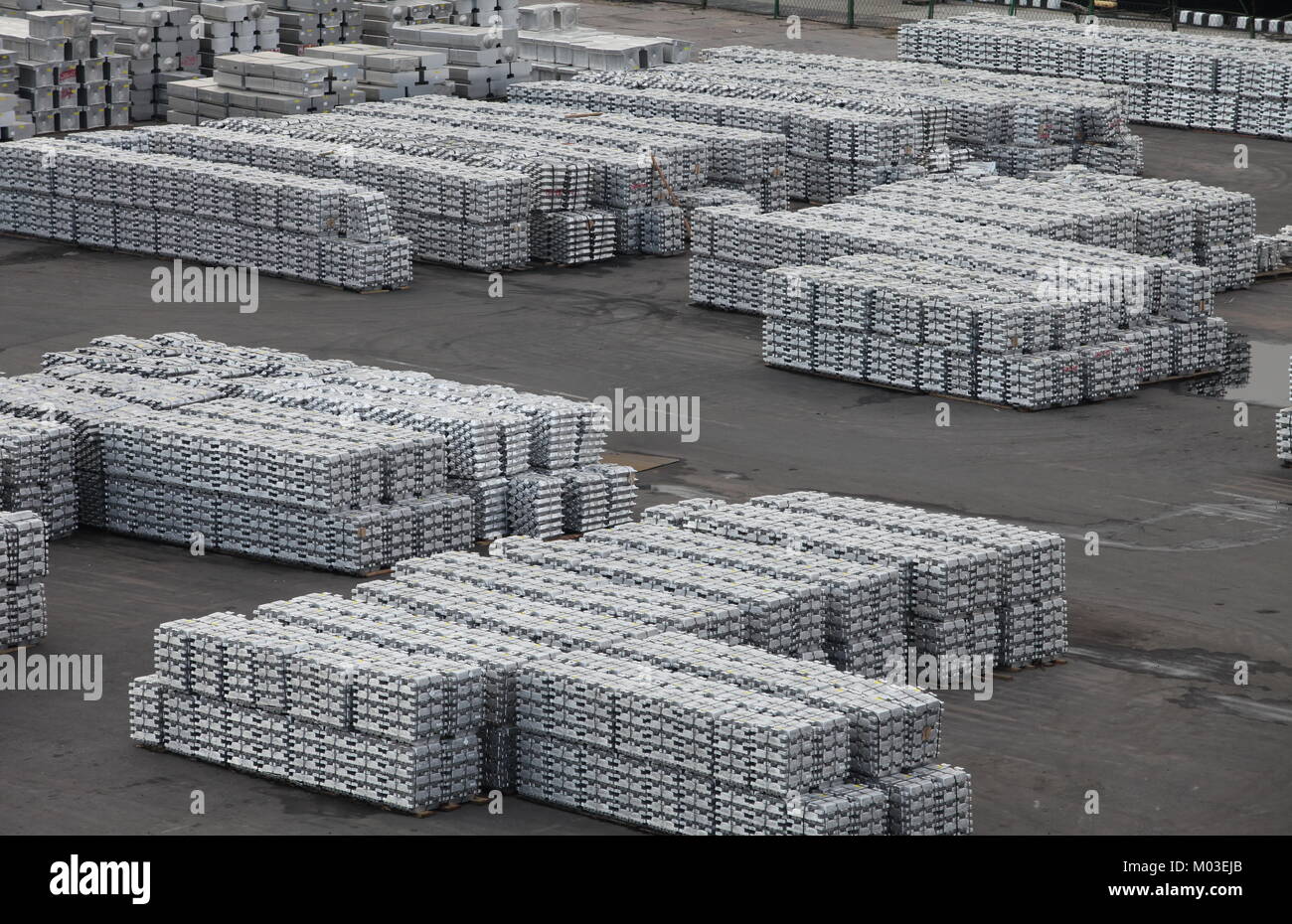 Metal aluminum and titanium in ingots in the warehouse products Stock Photo Alamy