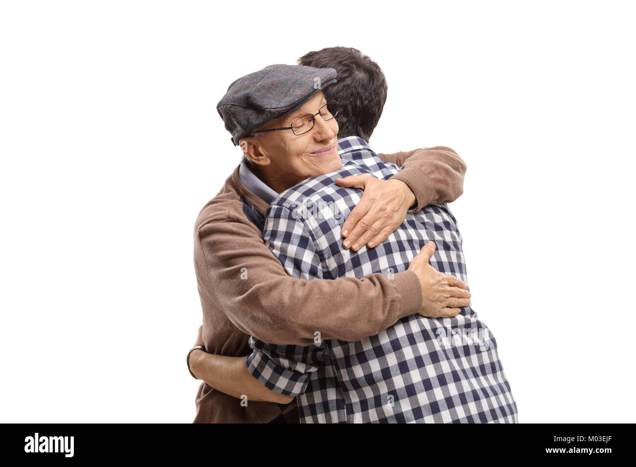 Elderly man and a young man hugging each other isolated on white background Stock Photo