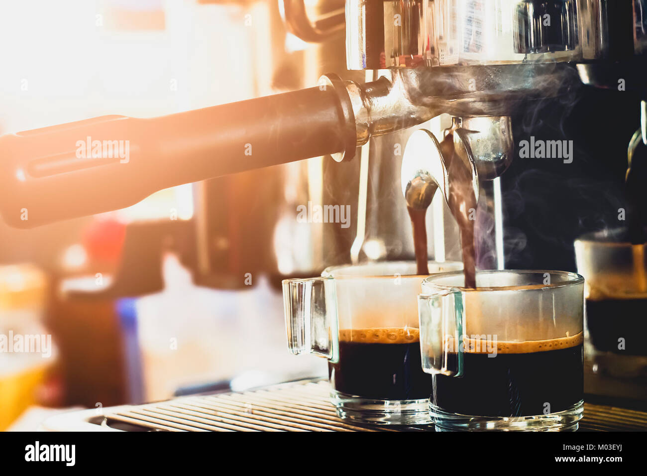 Close-up Of Espresso Machine Pouring Coffee In A Glass Stock Photo