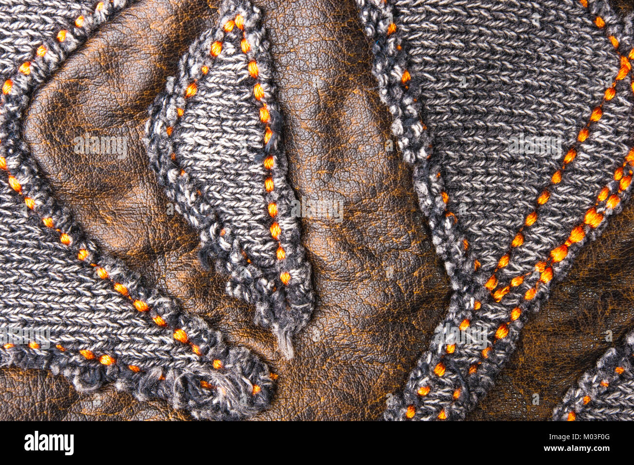texture of a washed thick knit fabric, with decorative elements, seams