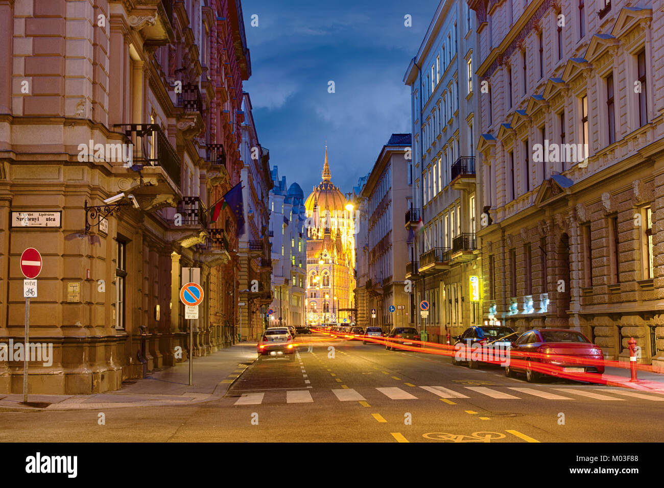 Akadémia street in Budapest, highlighted Parliament building at the end of the street Stock Photo