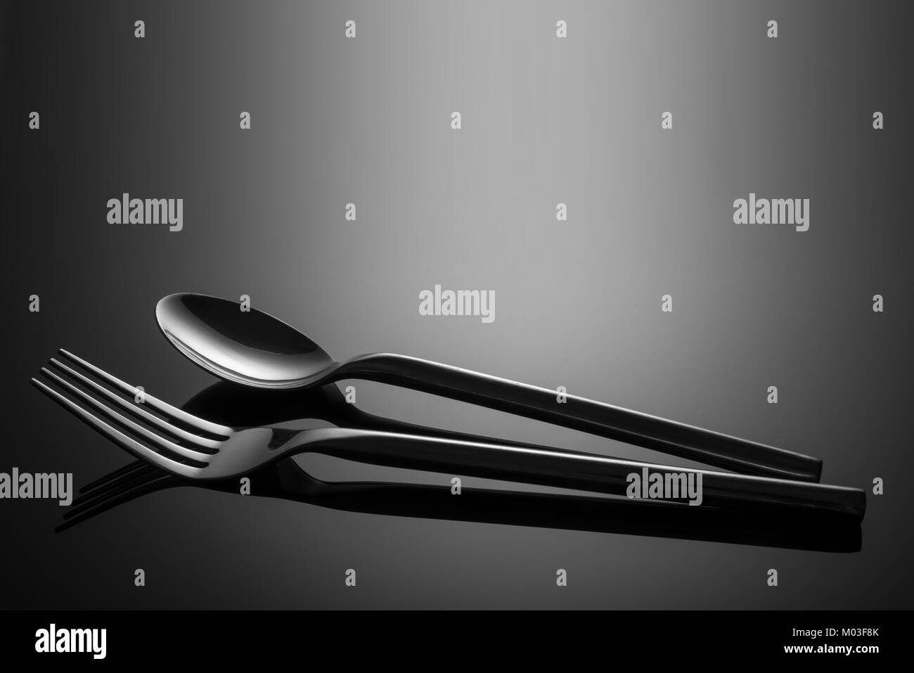 Fork and Spoon with shadows Stock Photo