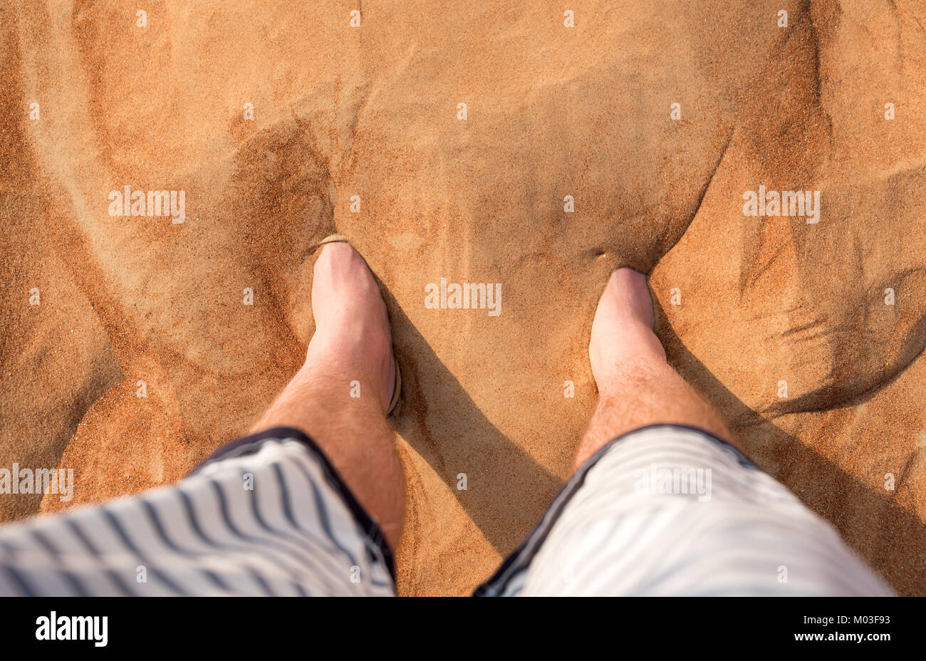 Covered feet in the desert sands of Dubai Stock Photo Alamy